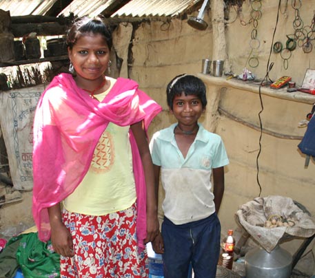 Devaki and her brother in their one room house